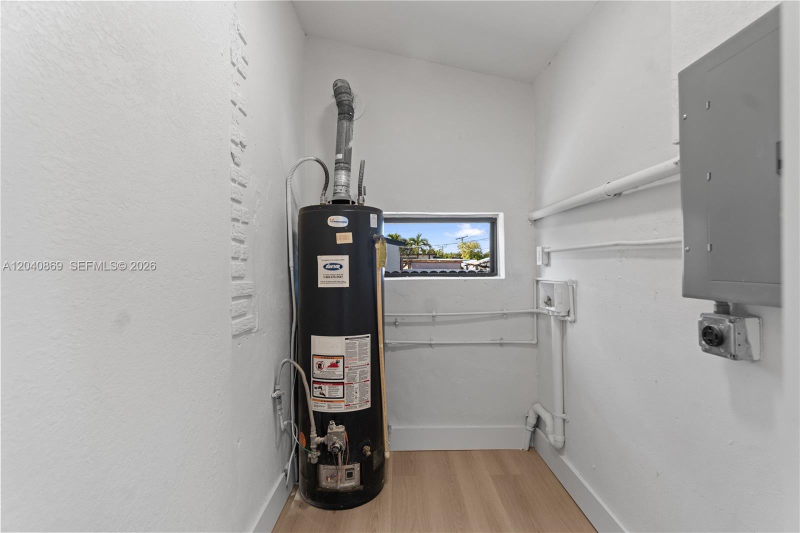 31 West 64th Street Hialeah, FL 33012 - Photo 23 of 49 a view of water heater room