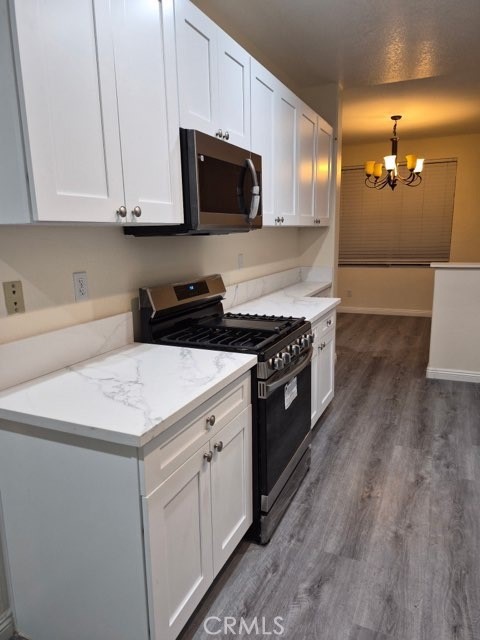 20 Altezza Irvine, CA 92606 - Photo 2 of 11 a kitchen with a sink stove and microwave