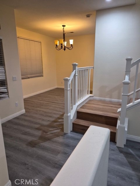 20 Altezza Irvine, CA 92606 - Photo 9 of 11 a view of a hallway with wooden floor and staircase