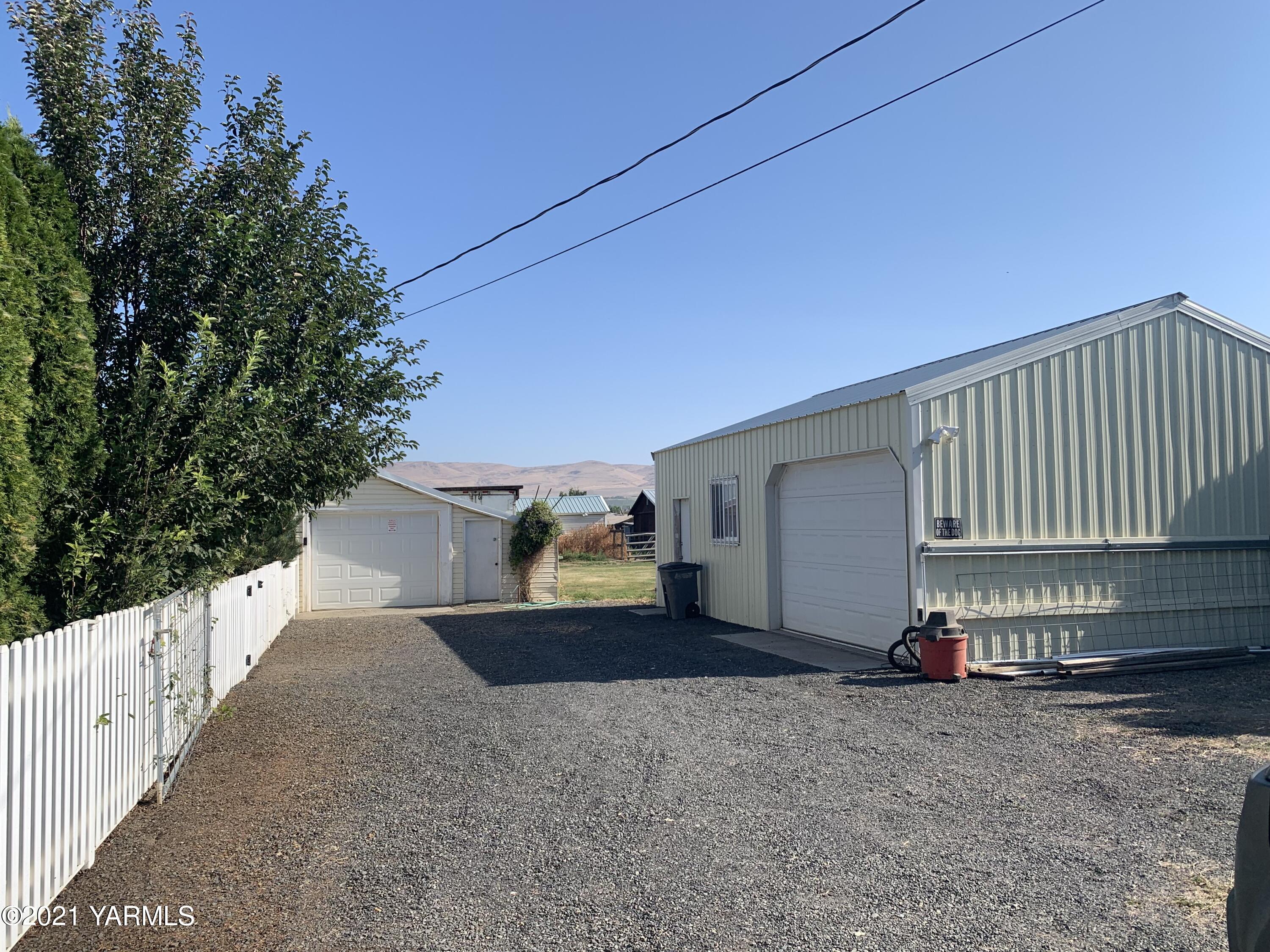 6807 Bell Road Yakima, WA 98901 - Photo 11 of 13 a view of a house with a backyard