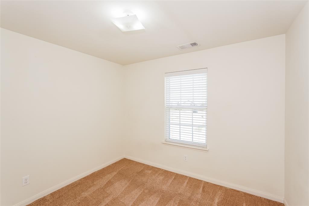 113 Rebel Road Venus, TX 76084 - Photo 11 of 17 a view of an empty room with a window
