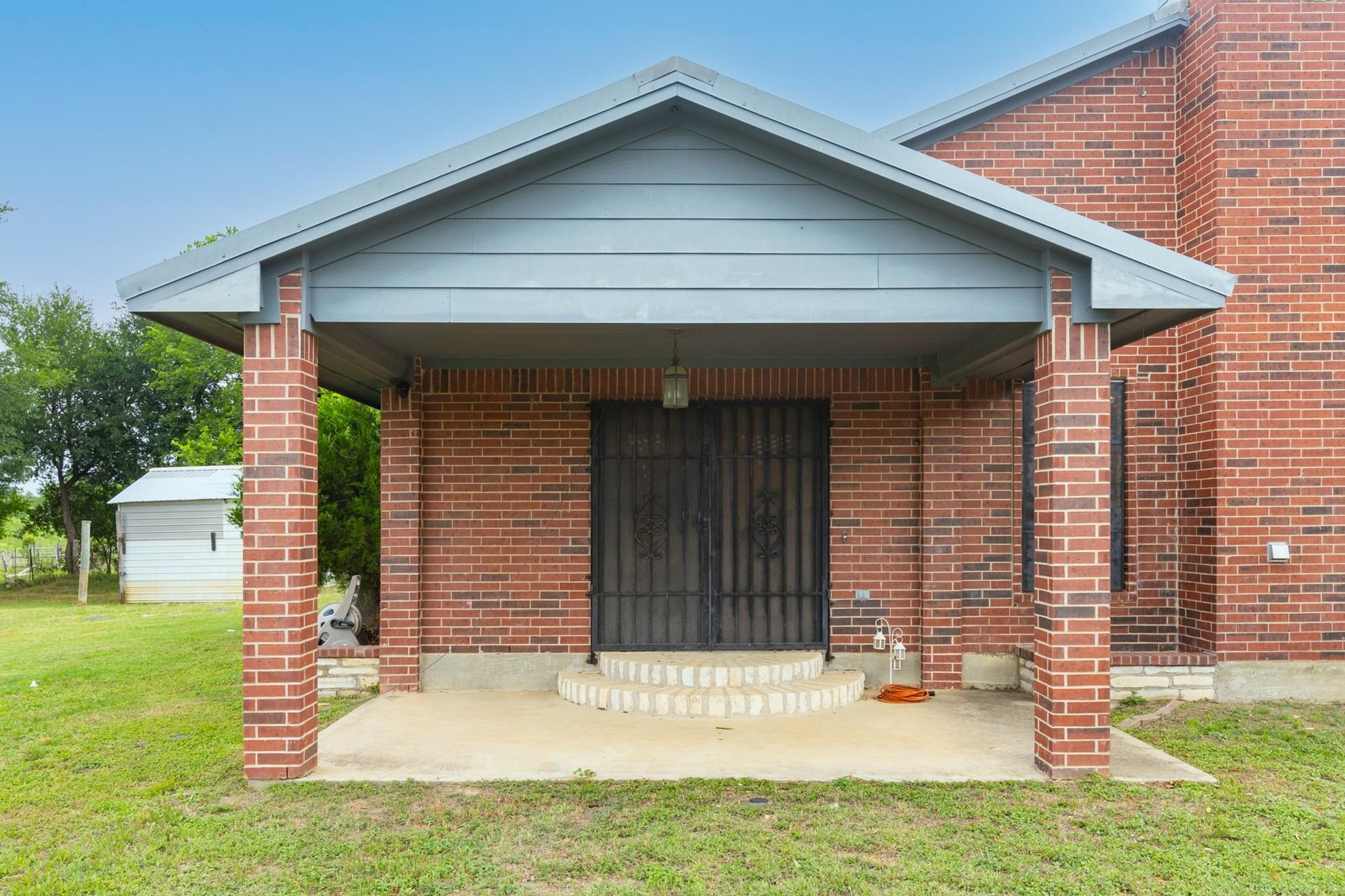 176 Old Lexington Road, Unit C Elgin, TX 78621 - Photo 3 of 31 a front view of a house with a yard
