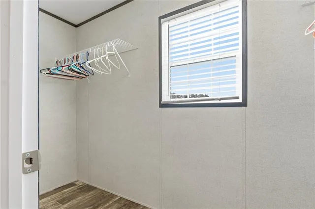 a view of a rack on the wall and a window