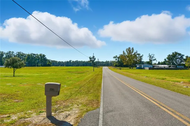 a view of a swimming pool and a yard