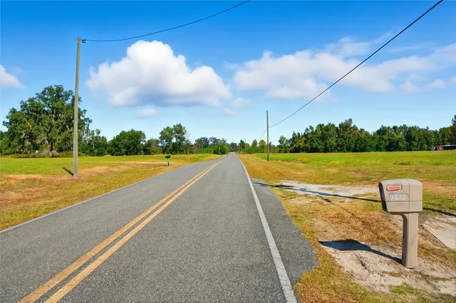 a view of a lake with a big yard