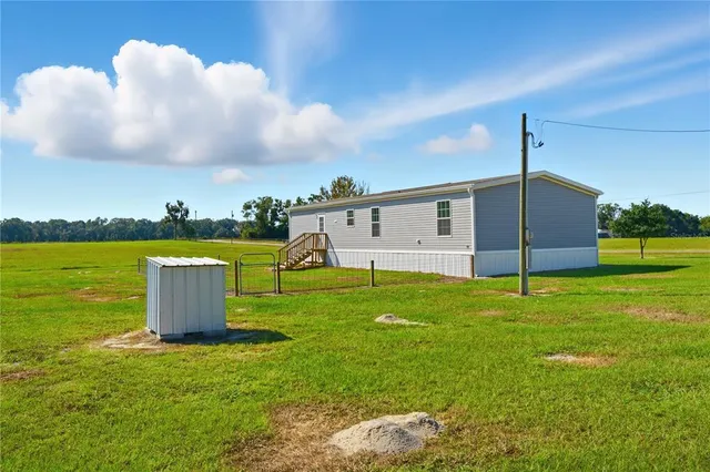 a fire hydrant in the middle of a field