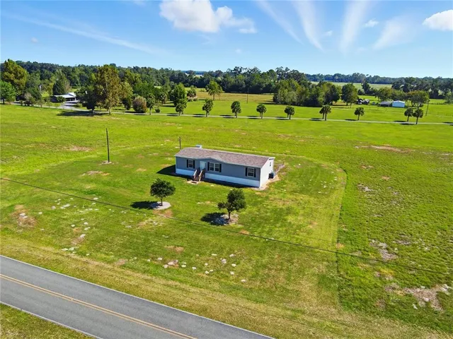 a view of a lake with a big yard