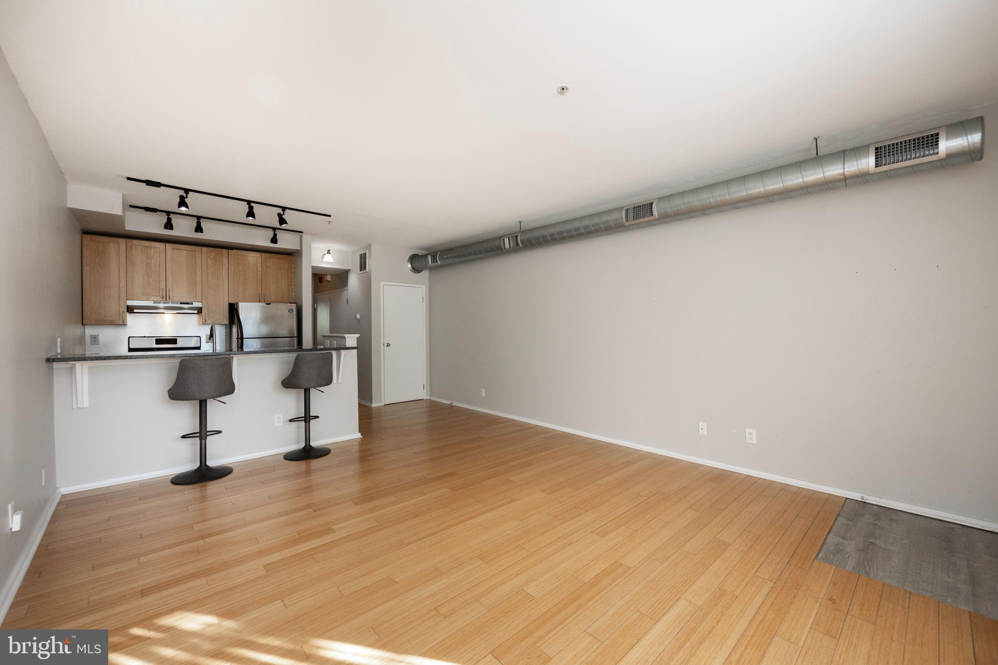 182 Gay Street, Unit 502 Philadelphia, PA 19128 - Photo 3 of 21 a view of kitchen and wooden floor