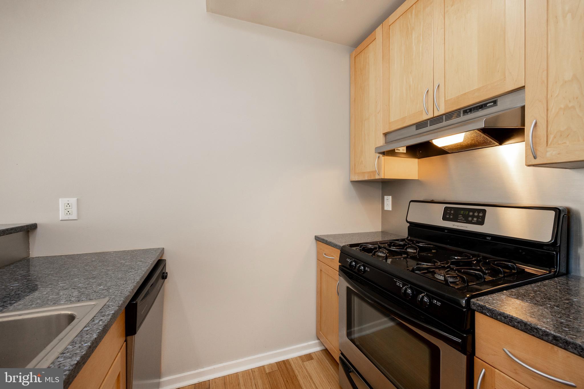 182 Gay Street, Unit 502 Philadelphia, PA 19128 - Photo 5 of 21 a stove top oven sitting inside of a kitchen