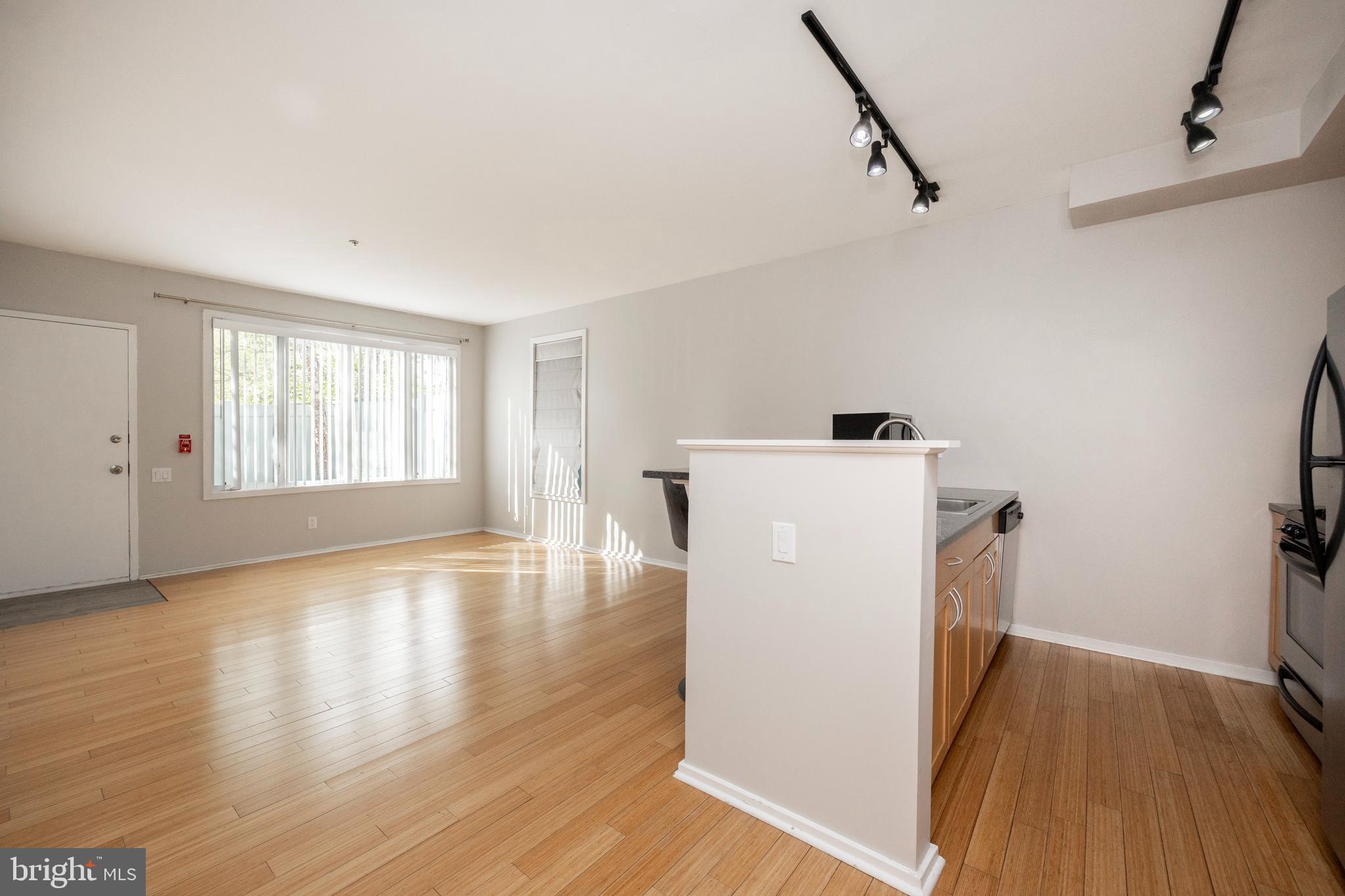 182 Gay Street, Unit 502 Philadelphia, PA 19128 - Photo 8 of 21 a view of a room with wooden floor and cabinet