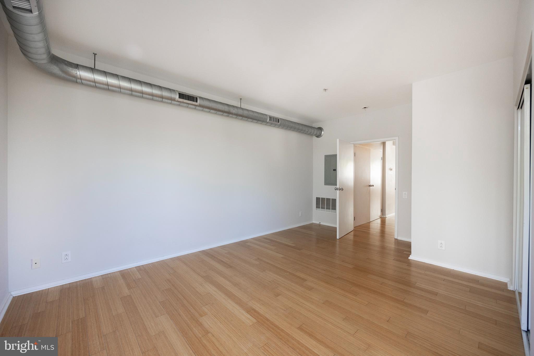 182 Gay Street, Unit 502 Philadelphia, PA 19128 - Photo 9 of 21 a view of an empty room with wooden floor
