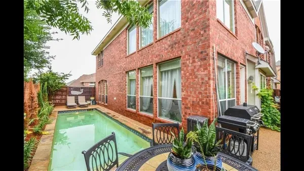 a view of swimming pool with patio