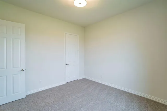 a bathroom with a sink a toilet a shower and a mirror