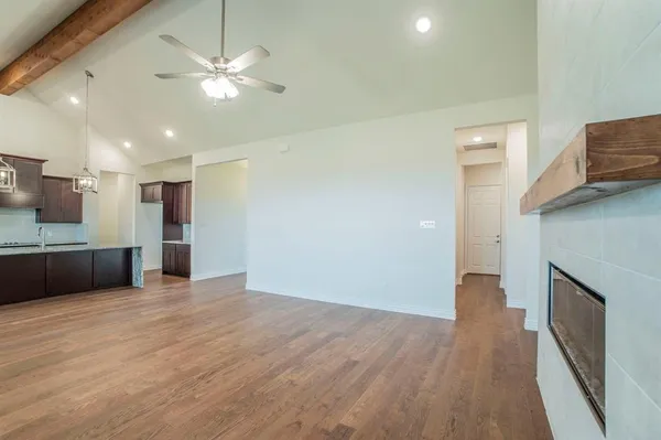 a view of a kitchen with a sink and a large window
