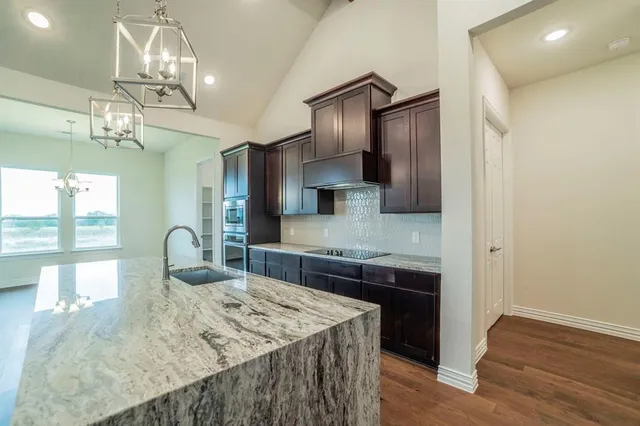 a view of a kitchen with a sink and a kitchen counter top