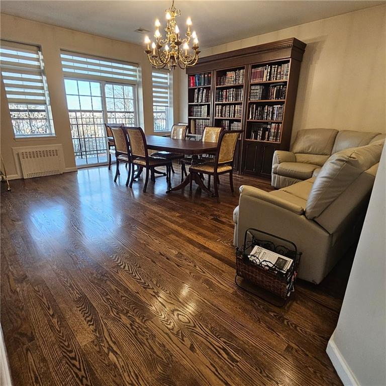 1012 41st Street, Unit 4 Brooklyn, NY 11219 - Photo 2 of 12 a living room with furniture a bookshelf and a wooden floor