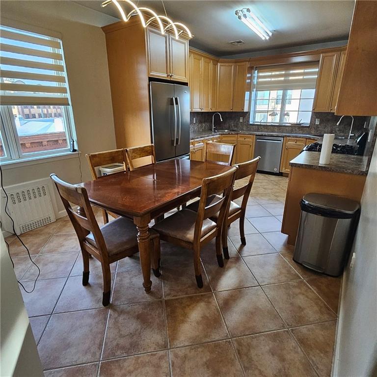 1012 41st Street, Unit 4 Brooklyn, NY 11219 - Photo 6 of 12 a view of a dining room with furniture