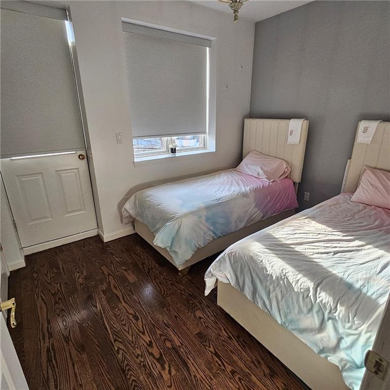 1012 41st Street, Unit 4 Brooklyn, NY 11219 - Photo 10 of 12 a bedroom with two beds and painted walls