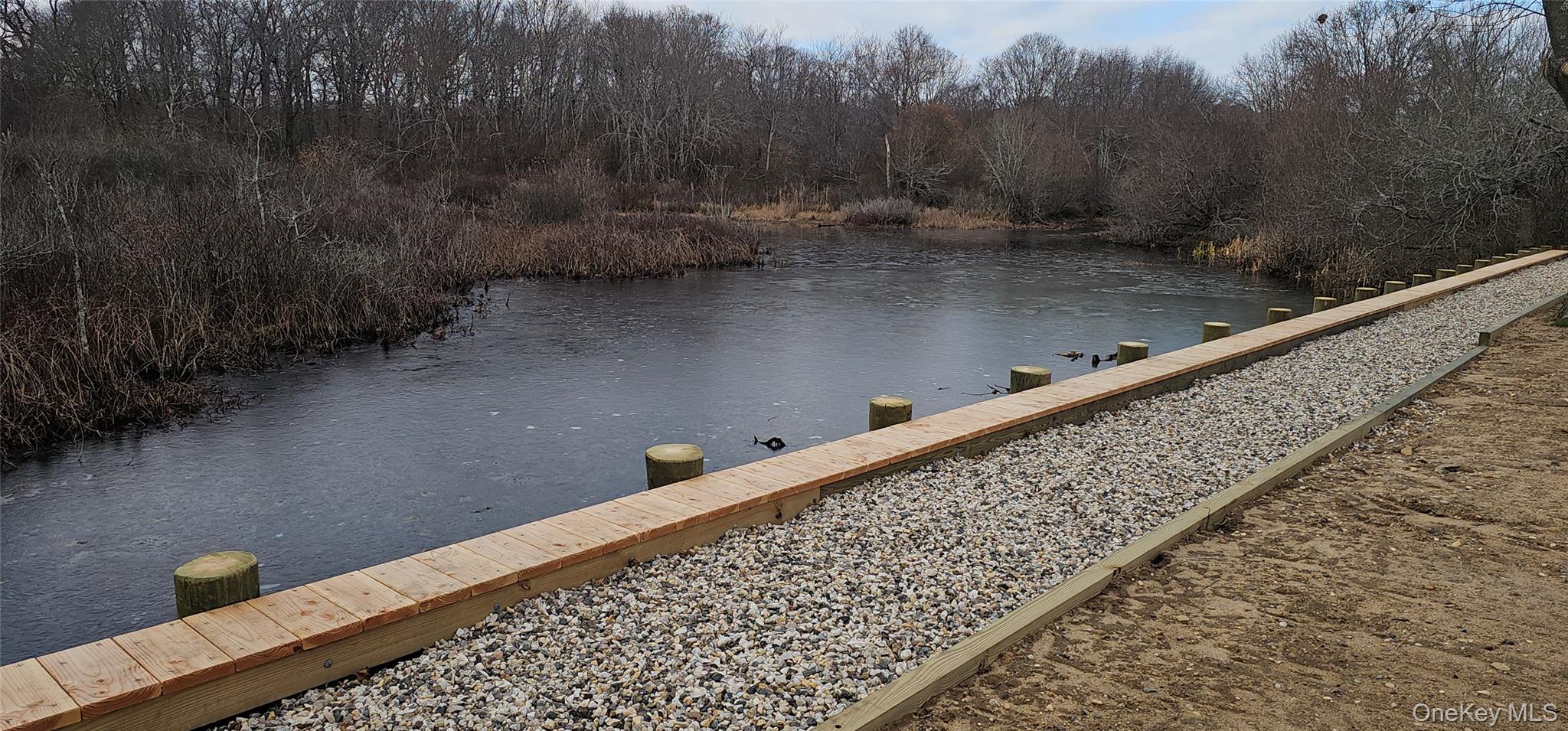 1964 River Road, Unit 35 Calverton, NY 11933 - Photo 14 of 14 Dock area featuring a water view