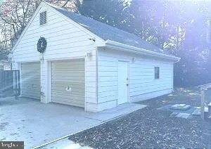 a view of small house with a tree