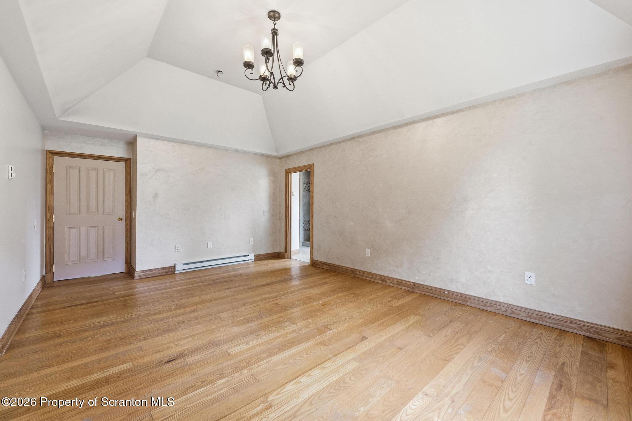 116 Forge Street Old Forge, PA 18518 - Photo 23 of 49 a view of an empty room with a chandelier fan