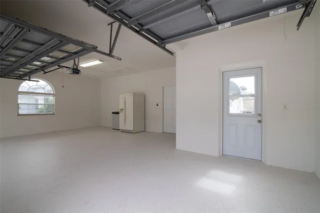 a living room with lots of furniture and a dining table with wooden floor