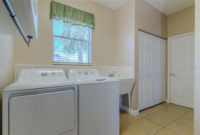 a utility room with dryer and washer