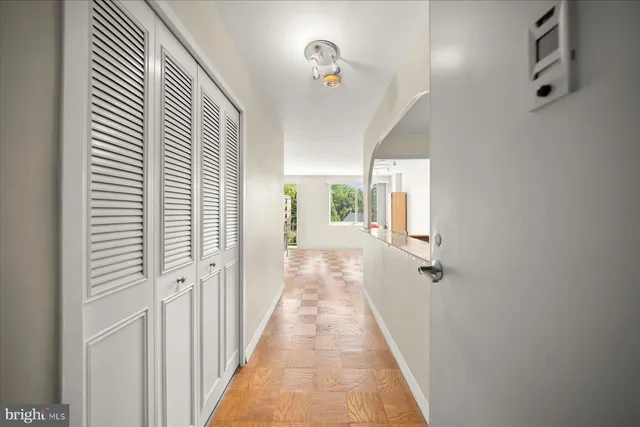 a view of a hallway with a window