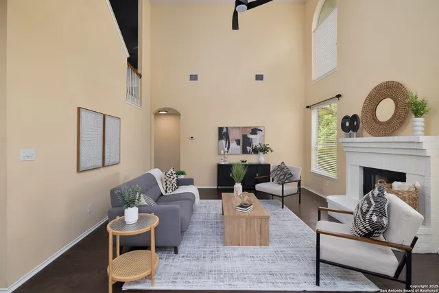 a living room with furniture and a fireplace