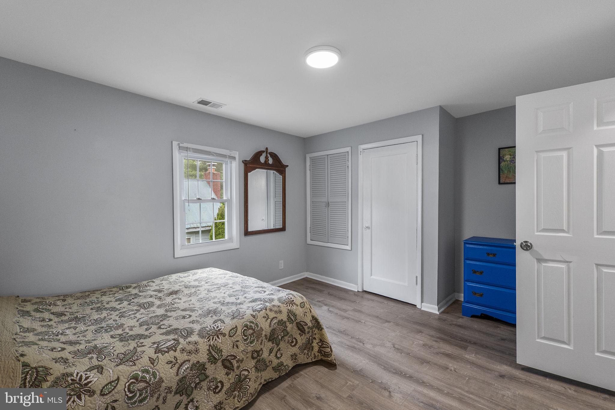 26001 Frederick Road Clarksburg, MD 20871 - Photo 22 of 46 a bedroom with a bed and a window