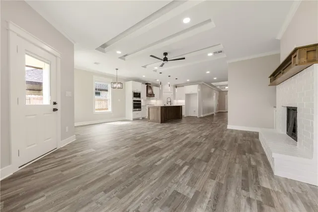 a view of a kitchen with a sink and a refrigerator