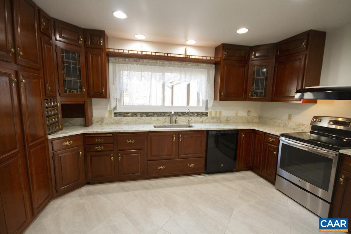 357 Logtrac Road Stanardsville, VA 22973 - Photo 8 of 36 a kitchen with a sink stove and cabinets