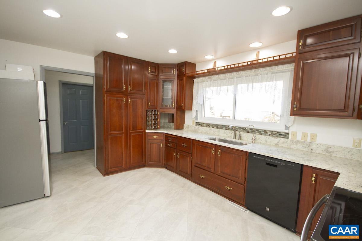 357 Logtrac Road Stanardsville, VA 22973 - Photo 10 of 36 a large kitchen with stainless steel appliances granite countertop a refrigerator and a sink
