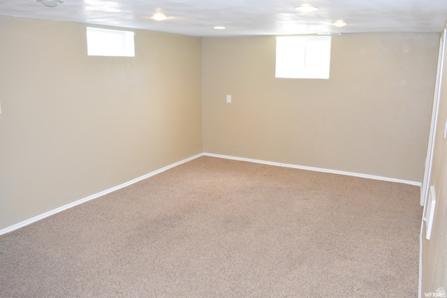490 Averett Avenue Springville, UT 84663 - Photo 9 of 14 Spacious room featuring neutral carpeting, light-colored walls, recessed lighting, and two transom windows