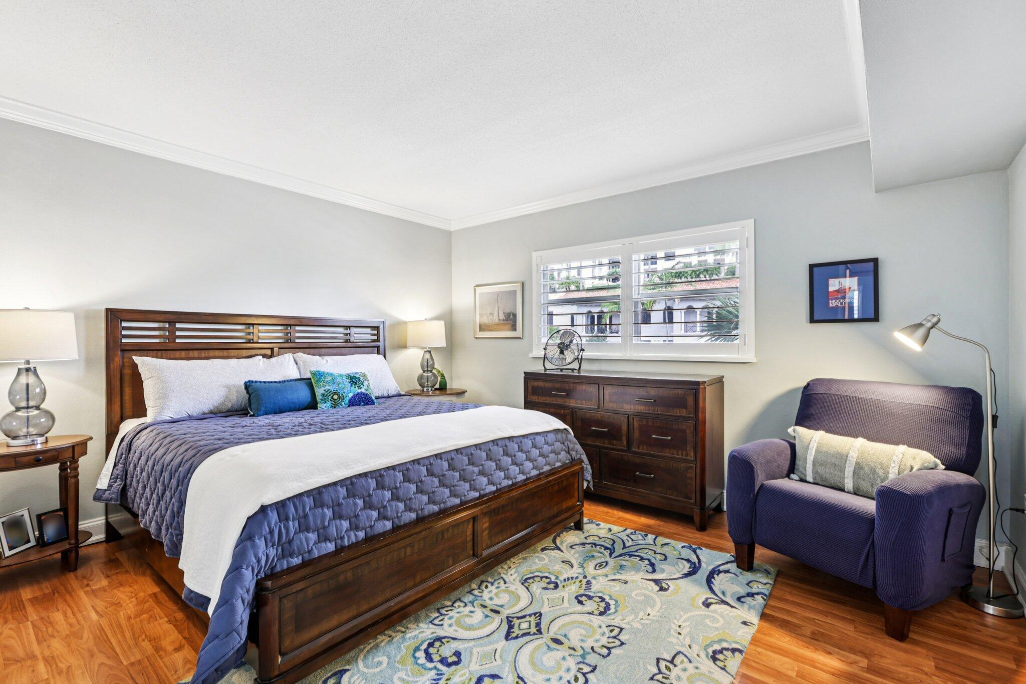 200 East Royal Palm Road, Unit 3030 Boca Raton, FL 33432 - Photo 14 of 30 a bedroom with a bed and furniture