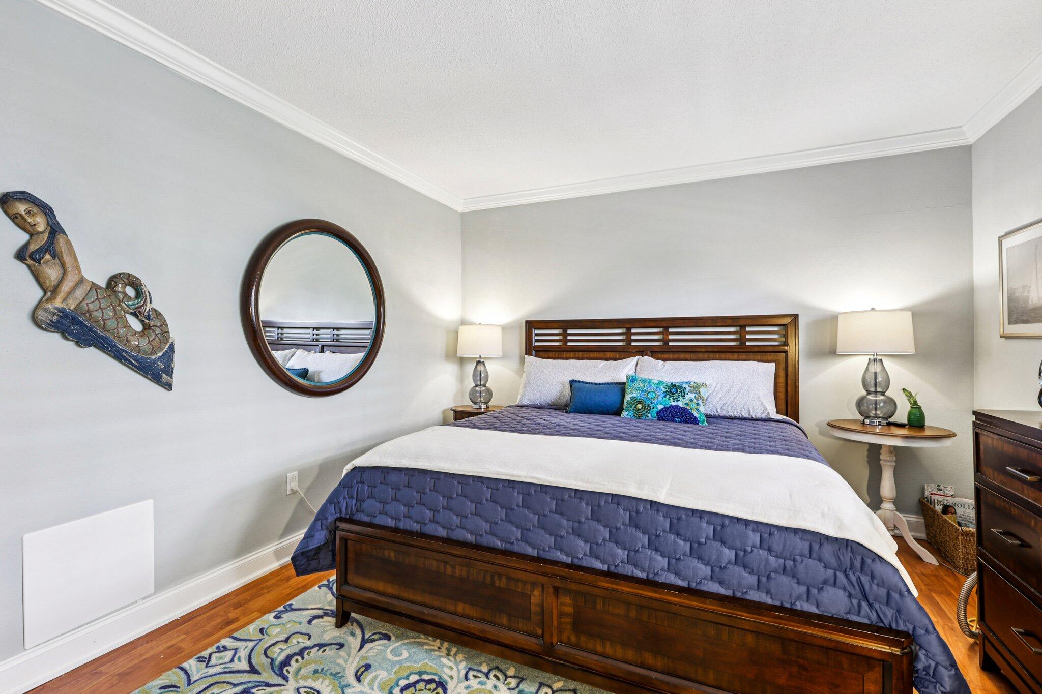 200 East Royal Palm Road, Unit 3030 Boca Raton, FL 33432 - Photo 15 of 30 a bedroom with a bed and a lamp on dresser