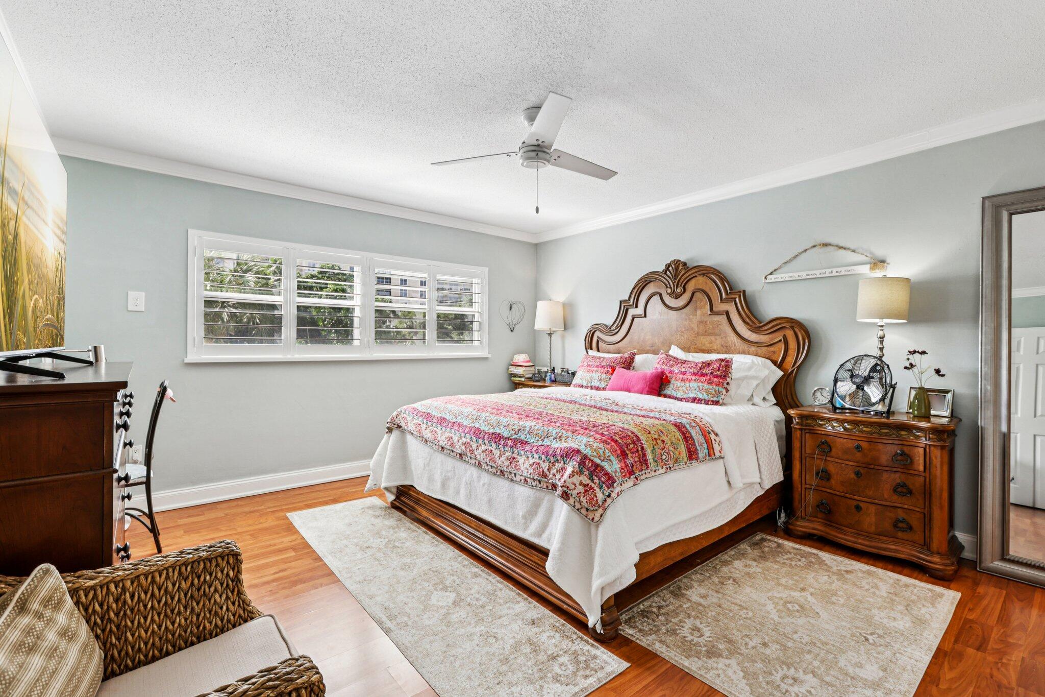 200 East Royal Palm Road, Unit 3030 Boca Raton, FL 33432 - Photo 20 of 30 a bedroom with a bed and wooden floor