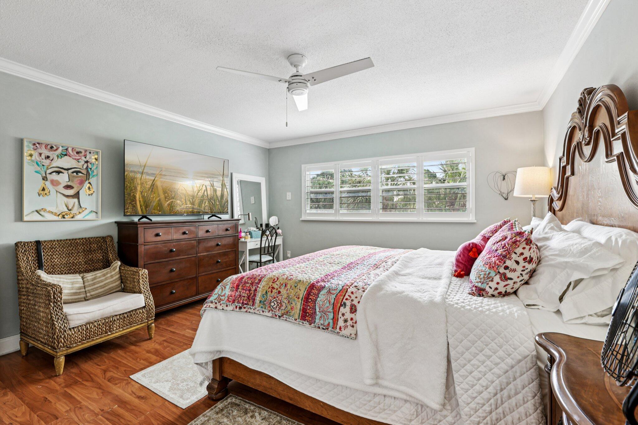 200 East Royal Palm Road, Unit 3030 Boca Raton, FL 33432 - Photo 23 of 30 a bedroom with a bed and glass window