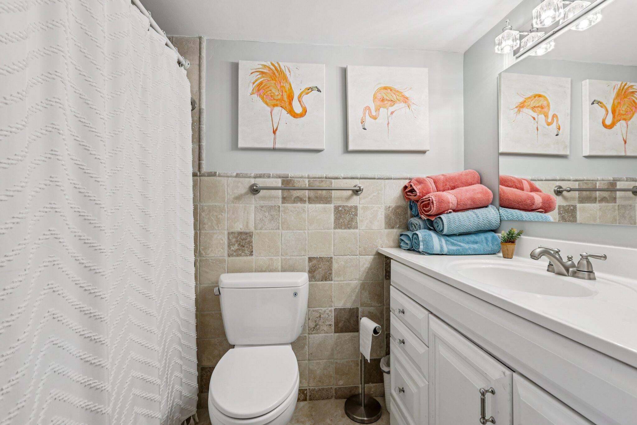 200 East Royal Palm Road, Unit 3030 Boca Raton, FL 33432 - Photo 25 of 30 a bathroom with a toilet sink and mirror