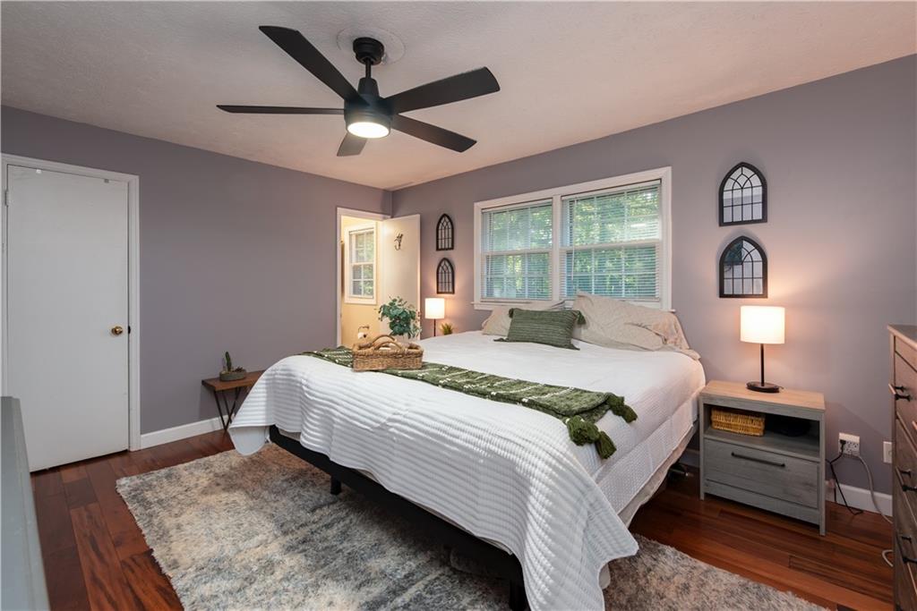 2598 Mountain View Road Snellville, GA 30078 - Photo 15 of 33 a bedroom with a large bed and a window