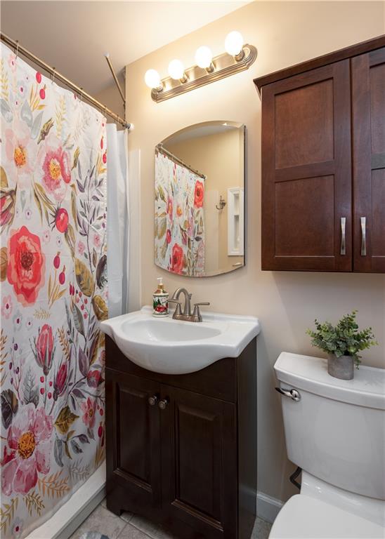 2598 Mountain View Road Snellville, GA 30078 - Photo 16 of 33 a bathroom with a sink toilet and vanity