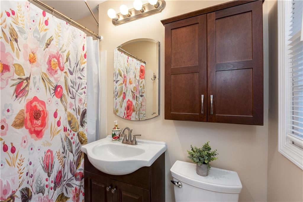 2598 Mountain View Road Snellville, GA 30078 - Photo 17 of 33 a bathroom with a sink and a mirror