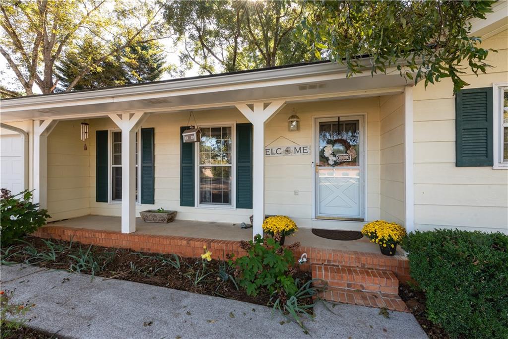 2598 Mountain View Road Snellville, GA 30078 - Photo 2 of 33 a front view of a house with garden