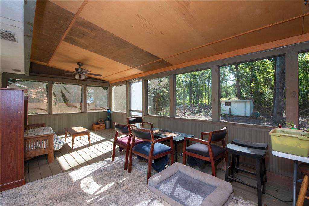 2598 Mountain View Road Snellville, GA 30078 - Photo 24 of 33 a living room with furniture and a floor to ceiling window