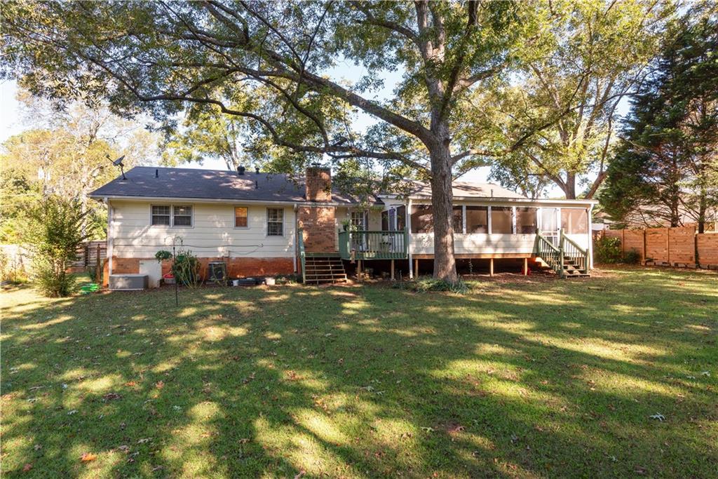 2598 Mountain View Road Snellville, GA 30078 - Photo 26 of 33 a front view of a house with a garden