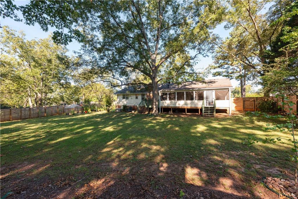 2598 Mountain View Road Snellville, GA 30078 - Photo 27 of 33 a front view of a house with a garden