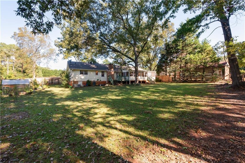 2598 Mountain View Road Snellville, GA 30078 - Photo 28 of 33 a view of a house with a big yard