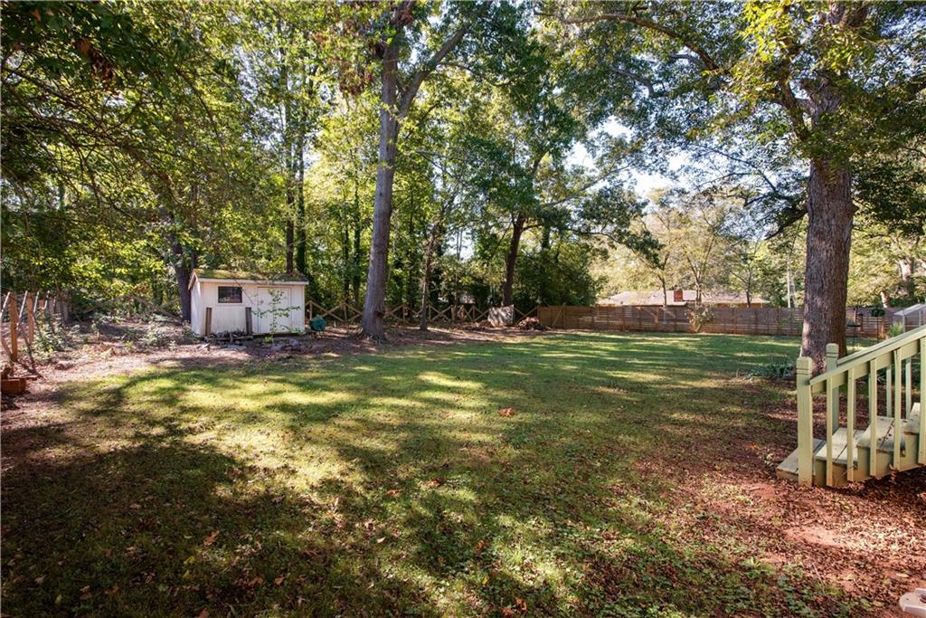 2598 Mountain View Road Snellville, GA 30078 - Photo 32 of 33 a view of a house with a yard