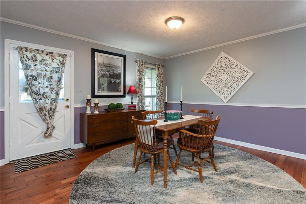 2598 Mountain View Road Snellville, GA 30078 - Photo 4 of 33 a view of a dining room with furniture window and wooden floor