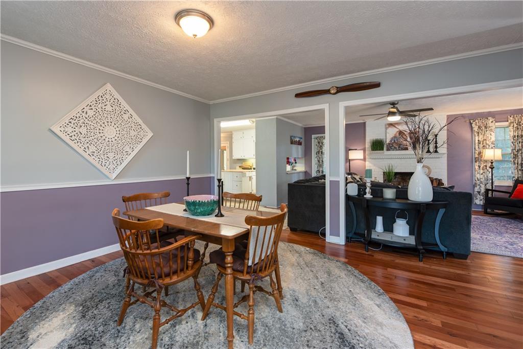 2598 Mountain View Road Snellville, GA 30078 - Photo 5 of 33 a dining room with furniture and wooden floor